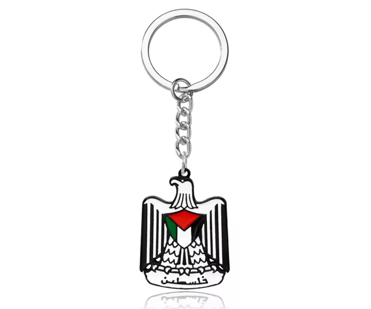 Nøkkelring med ørn-symbol og palestinske farger i midten, festet til metallring.