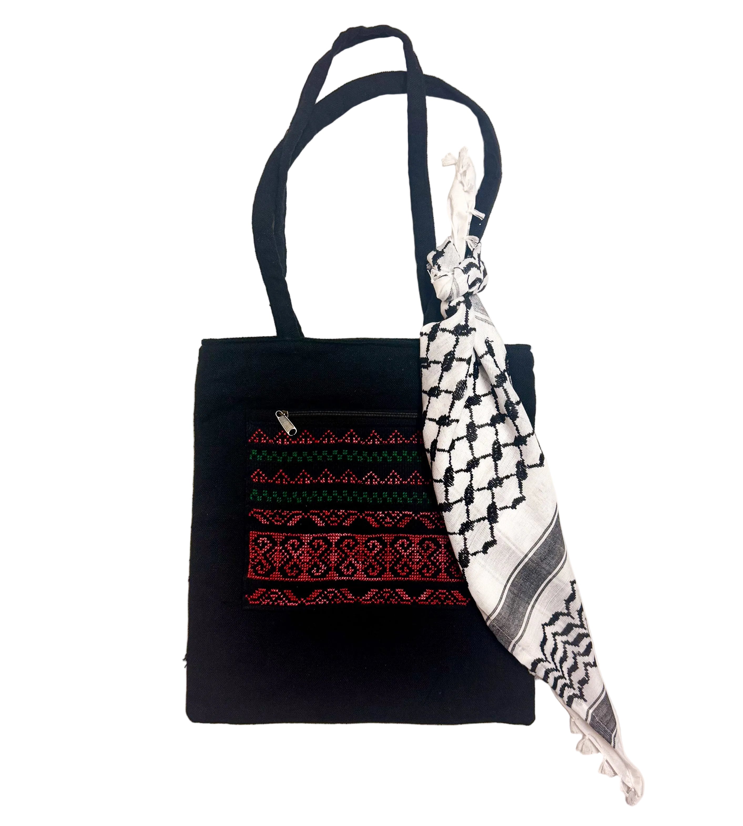 Kufiyeh-bandana i liten størrelse knyttet rundt skulderremmen på en tote bag, dekorativt tilbehør med tradisjonelt palestinsk mønster